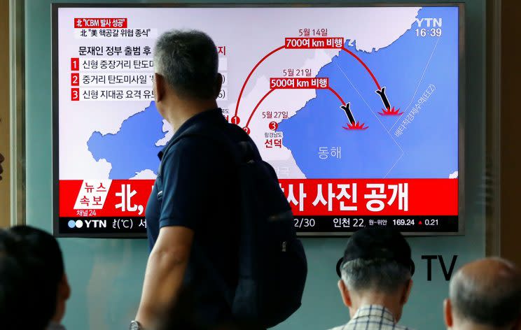 A man walks past a TV broadcasting a news report on the successful testing of North Korea Hwasong-14 missile (Photo: Kim Hong-Ji/Reuters)