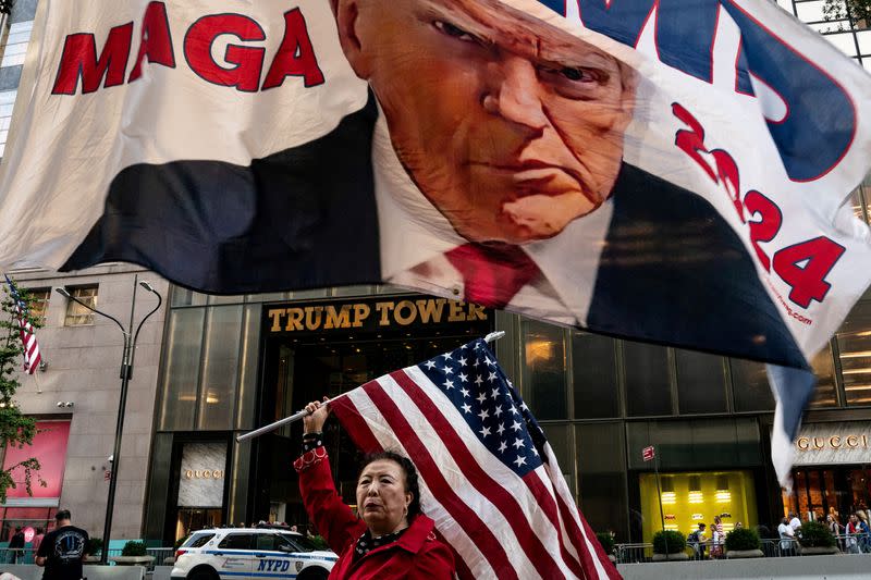 Former U.S. President Donald Trump's supporters gather at Trump Tower in New York City