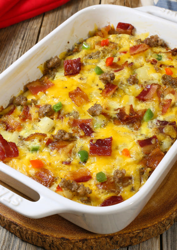 <p>The Slow Roasted Italian</p><p>Fully Loaded Cheesy Breakfast Casserole is all of our favorite things in an easy breakfast recipe that you can make ahead. Packed with eggs, potatoes, veggies, sausage AND bacon it is truly a full breakfast in one dish. The overnight cooking method makes this a winner in my house!</p><p><strong>Get the recipe: </strong><strong><a href="https://www.theslowroasteditalian.com/2017/05/fully-loaded-cheesy-breakfast-casserole.html" rel="nofollow noopener" target="_blank" data-ylk="slk:Fully Loaded Cheesy Breakfast Casserole;elm:context_link;itc:0;sec:content-canvas" class="link rapid-noclick-resp">Fully Loaded Cheesy Breakfast Casserole</a></strong></p>