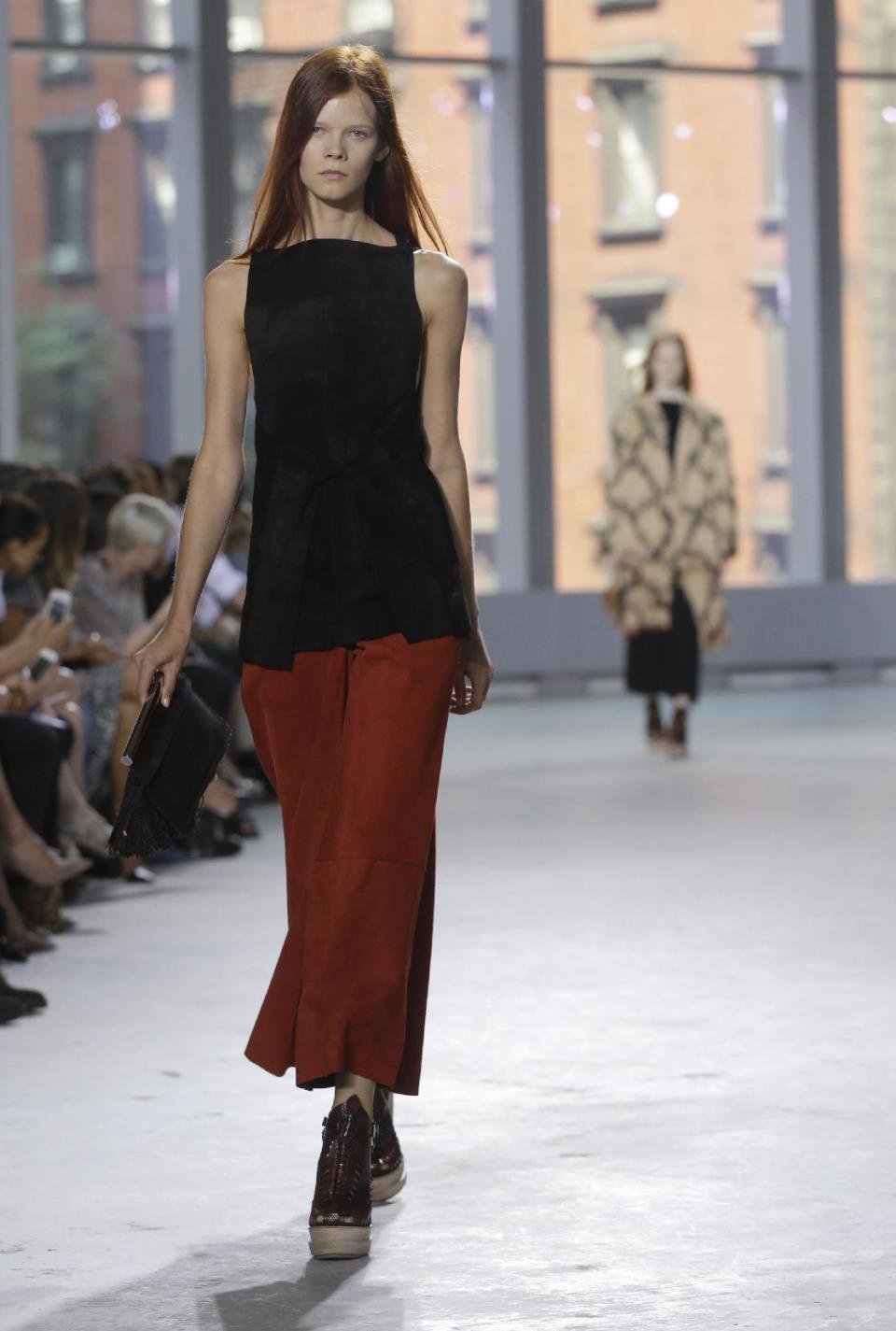 The Proenza Schouler Spring 2014 collection is modeled during Fashion Week in New York, Wednesday, Sept. 11, 2013. (AP Photo/Seth Wenig)