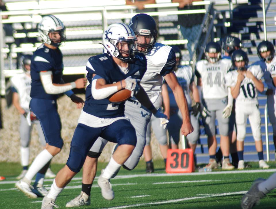 St. Thomas Aquinas running back Aidan Gorman turns the corner and picks up yards during Friday's 12-9 win over Merrimack.