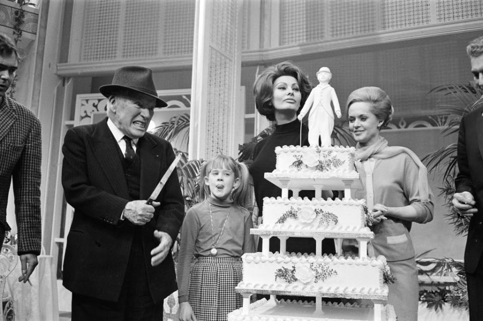 1966: Melanie Griffith gets a slice of cake from Charlie Chaplin