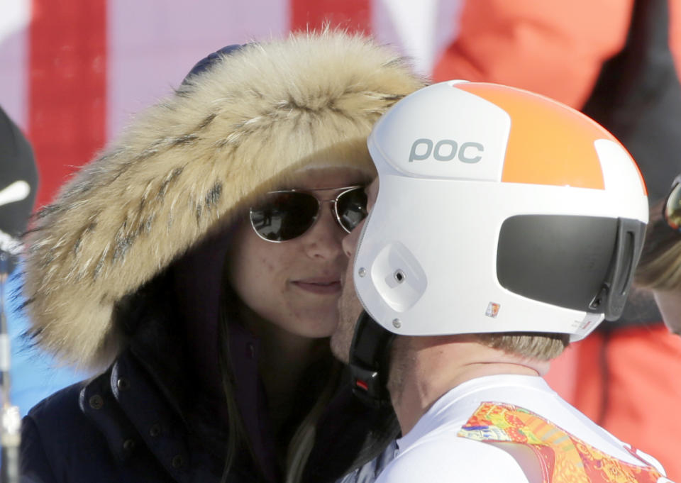 United States' Bode Miller kisses his wife, Morgan, after a men's downhill training run for the Sochi 2014 Winter Olympics, Saturday, Feb. 8, 2014, in Krasnaya Polyana, Russia. (AP Photo/Gero Breloer)