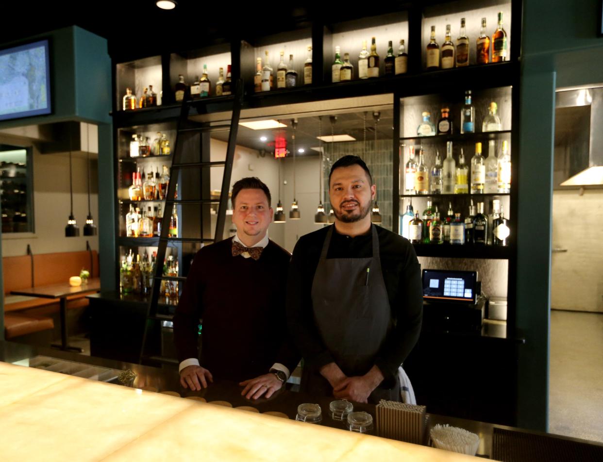 Co-owners Brad Canniff, left, and Juan Rodriguez stand in the bar area Tuesday, March 21, 2023, at Essence Restaurant + Bar in Elkhart.