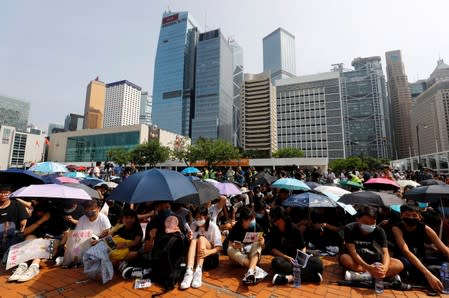 Students stage a rally to call for political reforms outside City Hall in Hong Kong