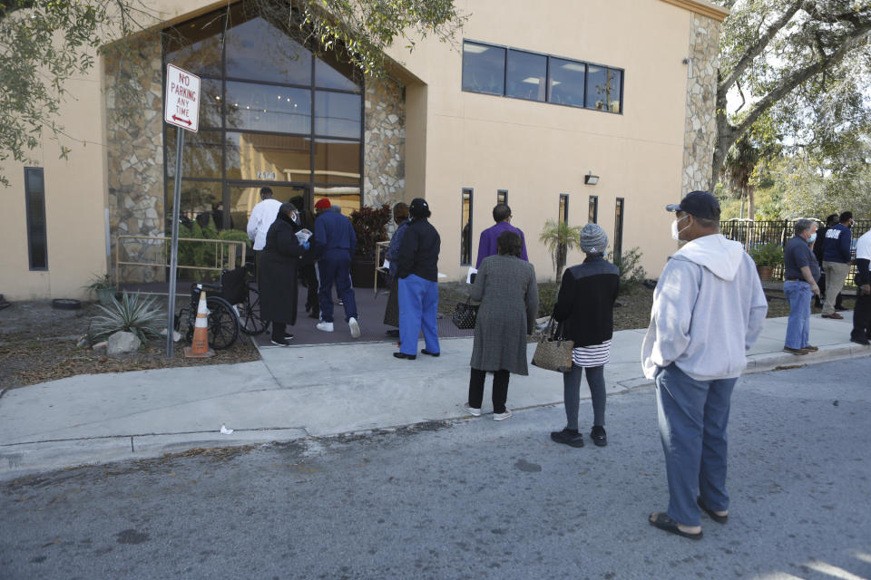 Residents wait in line to receive the COVID-19 vaccine at St. Johns Missionary Baptist Church on January 10, 2021 in Tampa, Florida. (Octavio Jones/Getty Images)