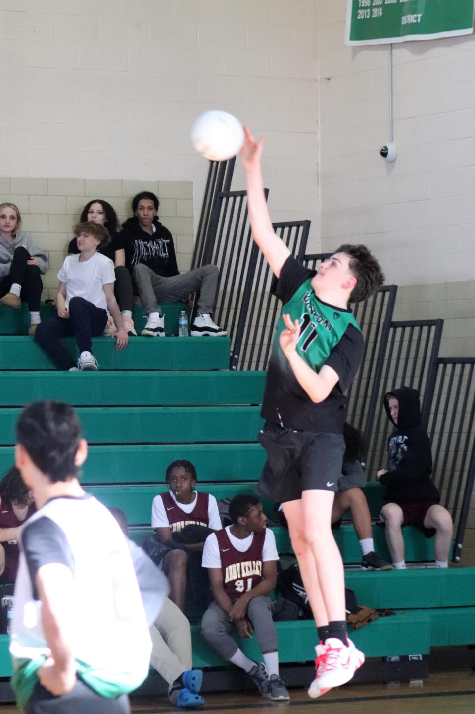 Burncoat captain Jayden Mott powers the ball over the net.