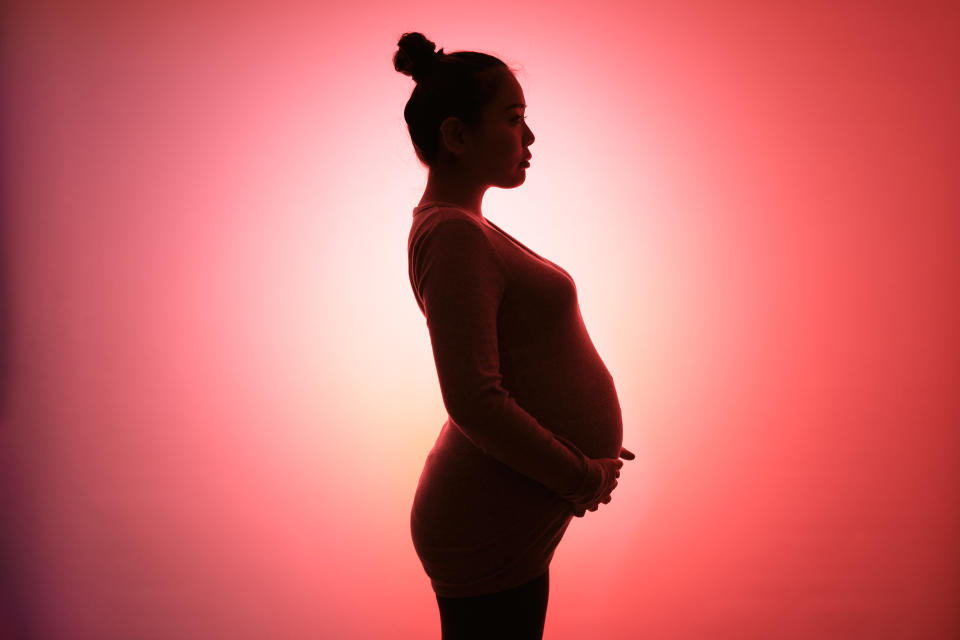 The pregnant woman has a silhouette.