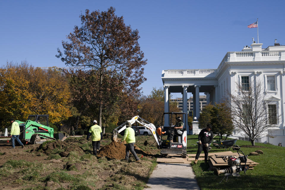 Landscapers work on replacing the lawn of the White House, Monday, Nov. 9, 2020, in Washington. (AP Photo/Evan Vucci)