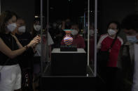 Visitors tour the Hong Kong Palace Museum during the first day open to public in Hong Kong, Sunday, July 3, 2022. It showcases more than 900 Chinese artefacts, loaned from the long-established Palace Museum in Beijing, home to works of art representing thousands of years of Chinese history and culture. (AP Photo/Kin Cheung)