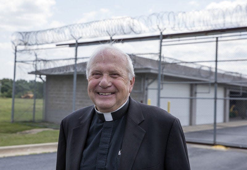 The Rev. David Link poses in front of the South Bend Community Re-entry Center in South Bend several years ago. Santiago Flores, South Bend Tribune file