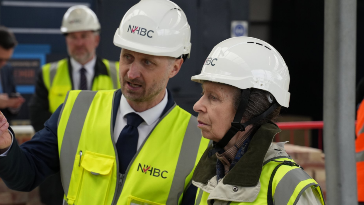  Mr Stewart with Princess Anne, both wearing high visibility jackets and white helmets
