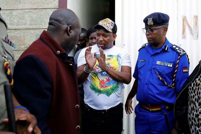 Nairobi's Governor Mike Sonko is escorted by police officers after his arrest, at the Wilson airport in Nairobi