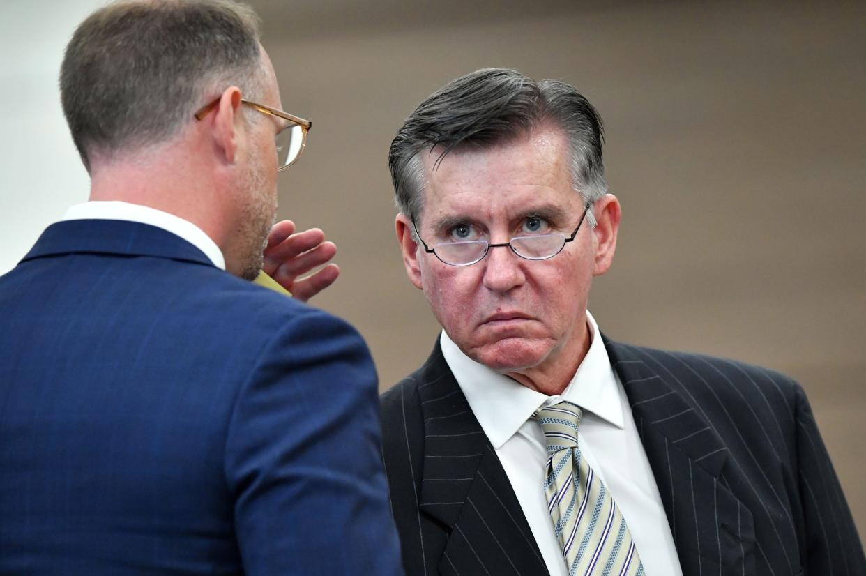 Kowalski family attorney Nick Whitney, left, whispers to Greg Anderson during cross examination of a witness Thursday, Oct. 19, 2023 at the South County Courthouse in Venice, Florida. The Kowalski family is suing Johns Hopkins All Children's Hospital for false imprisonment, negligent infliction of emotional distress, medical negligence, battery, and other claims more than a year after the family matriarch, Beata Kowalski, took her life following allegations she was abusing her daughter, Maya Kowalski. Pool photo/Mike Lang/Sarasota Herald-Tribune