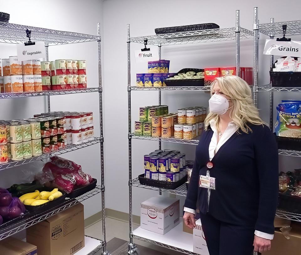 Director of Food and Nutrition/Clinical Nutrition Manager at University Hospitals-Sodexo Lynann Colella leads a tour of the Food for Life Market at UH Portage Medical Center, which includes a variety of canned goods, as well as produce, meat and dairy products.