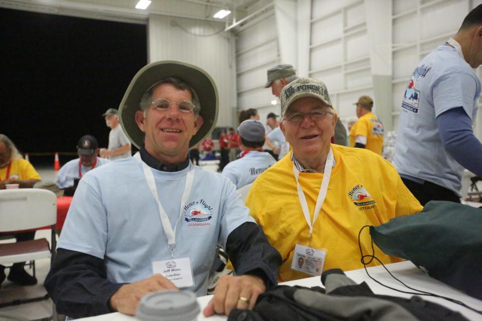 Jeff Mims, a guardian, and Wayne Langston, a Vietnam War veteran, pose for their picture as they wait for takeoff, April 27, 2024.