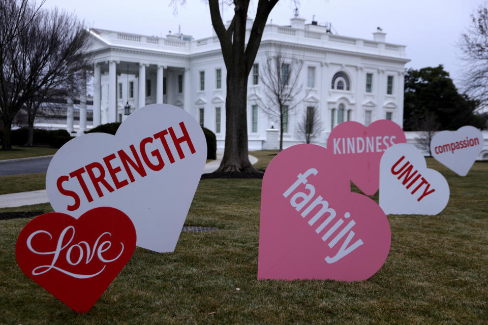 Heart-shaped signs with Valentine messages on the North Lawn of the White House on Feb. 12, 2021, in Washington, D.C. (Photo: Alex Wong via Getty Images)