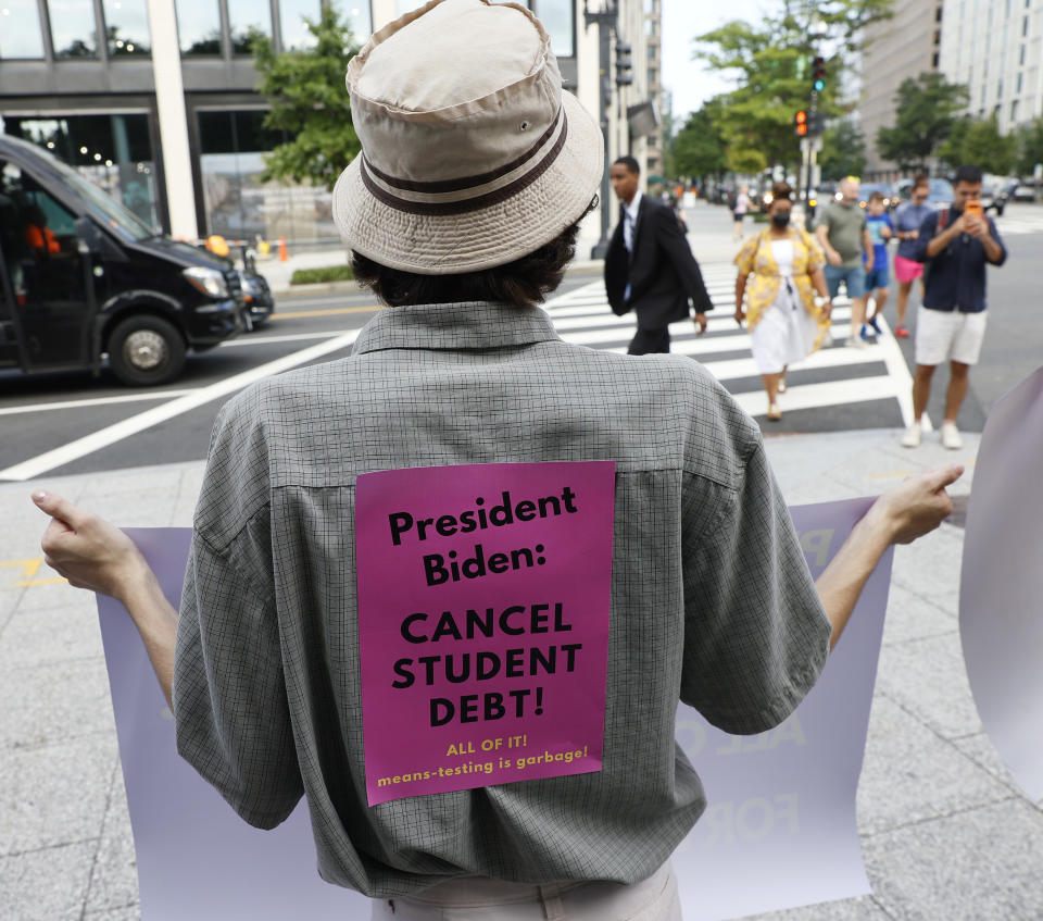 WASHINGTON, DC - JULY 27:  Student loan debt holders take part in a demonstration outside of the white house staff entrance to demand that President Biden cancel student loan debt in August on July 27, 2022 at the Executive Offices in Washington, DC. (Photo by Jemal Countess/Getty Images for We, The 45 Million)