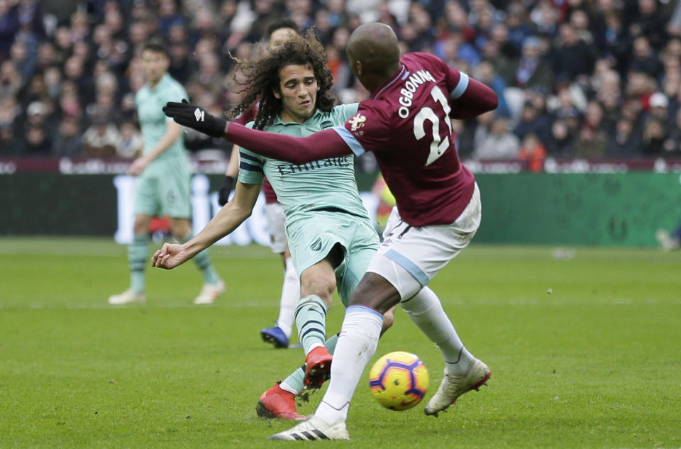 Arsenal's Matteo Guendouzi attempts a shot past West Ham's Angelo Ogbonna, right, during the English Premier League soccer match between West Ham United and Arsenal at London Stadium in London, Saturday, Jan. 12, 2019. (AP Photo/Tim Ireland)