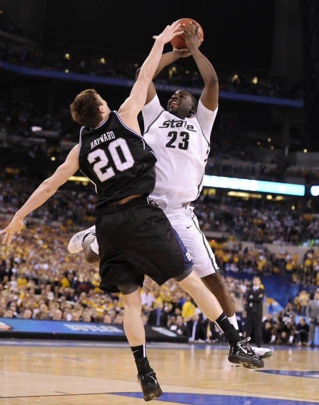 MSU's Draymond Green is hit by Butler's Gordon Hayward with less than 10 seconds remaining in their 2010 Final Four game. No foul was called on the play, with the Spartans trailing 50-49.