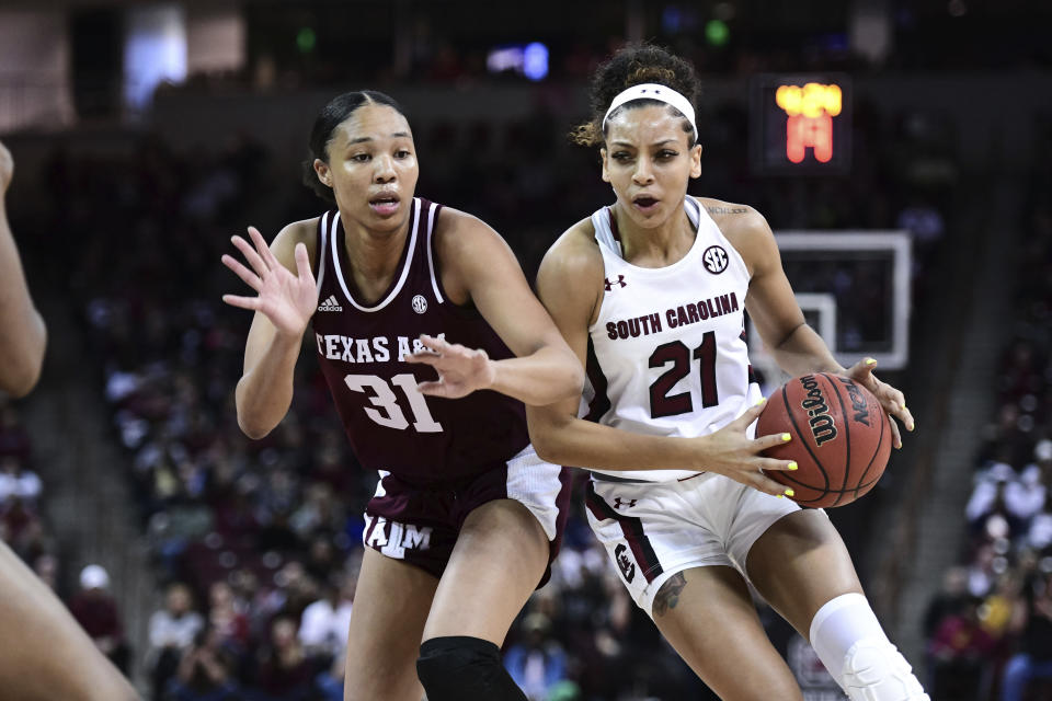 South Carolina forward Mikiah Herbert Harrigan (21) drives against Texas A&M forward N'dea Jones (31) during the first half of a women's NCAA college basketball game Sunday, March 1, 2020, in Columbia, S.C. (AP Photo/Sean Rayford)