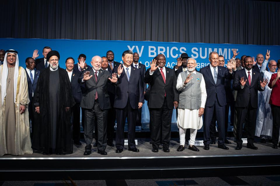 South African President Cyril Ramaphosa with fellow BRICS leaders President of Brazil Luiz Inacio Lula da Silva, President of China Xi Jinping, Prime Minister of India Narendra Modi, and Russia's Foreign Minister Sergei Lavrov pose for a family photo with delegates, including six nations invited to join the BRICS group, Argentina, Egypt, Ethiopia, Iran, the United Arab Emirates and Saudi Arabia, during the closing day of the BRICS Summit at the Sandton Convention Center on August 24, 2023 in the Sandton district of Johannesburg, South Africa.