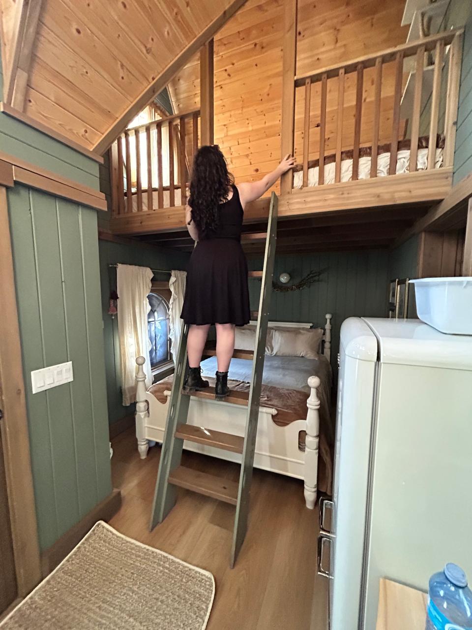 paige climbing the ladder in rapunzel's cottage