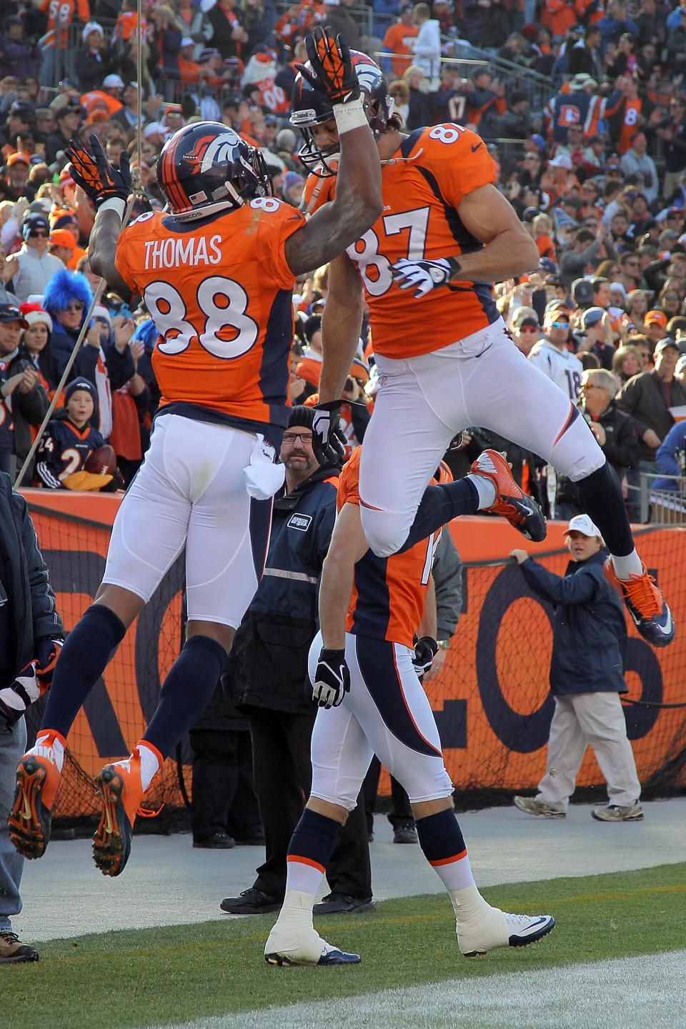 Wide receiver Demaryius Thomas #88 of the Denver Broncos celebrates his 22 yard touchdown reception with wide receiver Eric Decker #87 of the Denver Broncos in the first quarter against the Cleveland Browns at Sports Authority Field at Mile High on December 23, 2012 in Denver, Colorado. (Photo by Doug Pensinger/Getty Images)