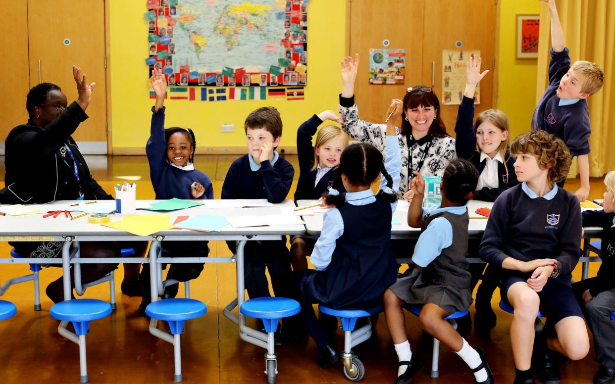 Children who are representatives for their class or year are seen learning and debating together at the school's council meeting - Clara Molden 