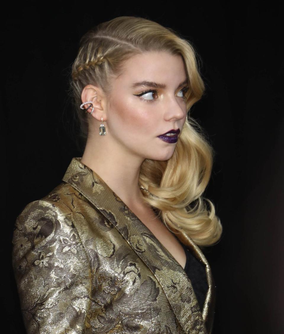 <p>Jazz up a side-swept curly hairstyle by weaving a single braid on the side. </p>