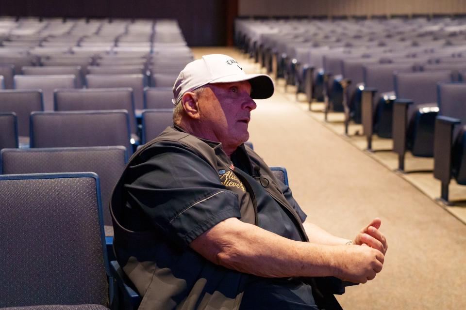 Daniel "Rudy" Ruettiger sits in the auditorium at Casa Grande High School before speaking to students on Sept. 7, 2023, in Casa Grande.