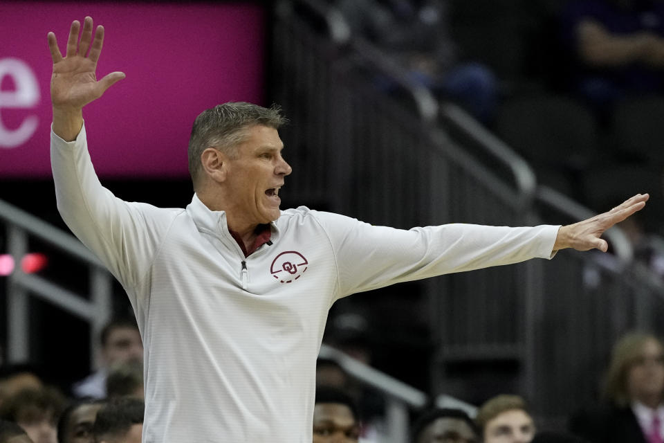 Oklahoma head coach Porter Moser motions to his players during the first half of an NCAA college basketball game against TCU Wednesday, March 13, 2024, in Kansas City, Mo. (AP Photo/Charlie Riedel)