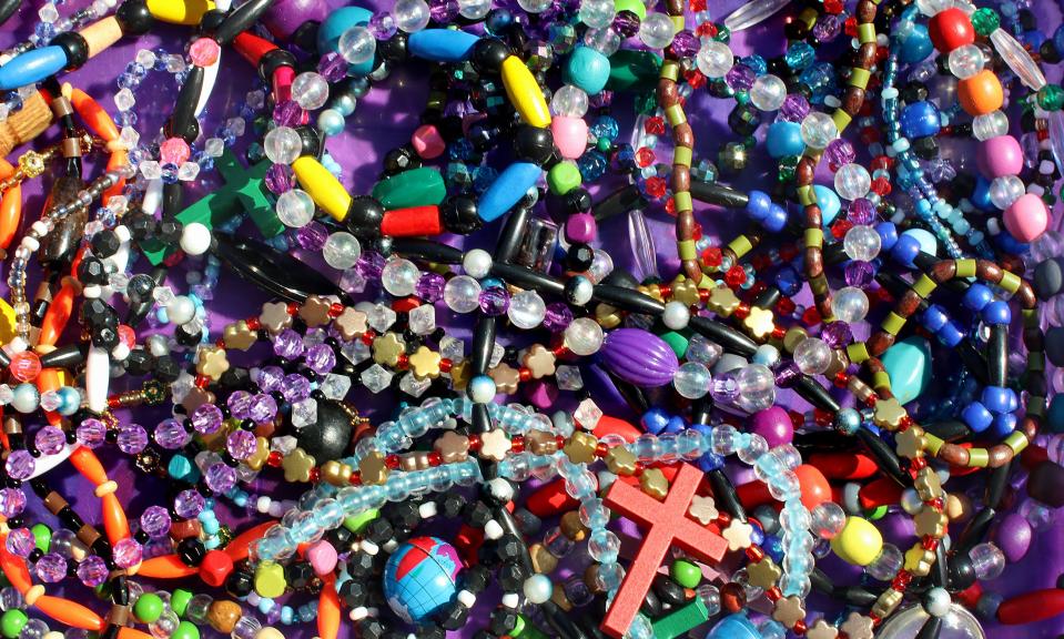 Colorful jewelry  made by Walasia Vinson foe sale at her table outside Sims Grocery on Buffalo Street in Shelby Friday afternoon, March 4, 2022.