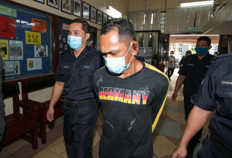 Scrap metal worker Arnee Ahamad Pazir claimed trial at the Magistrate’s Court in Ipoh to causing riot and damage to the Lahat police station here and also injuring a policeman in the process on January 24, 2021. — Picture by Farhan Najib