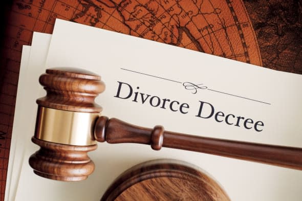 Gavel on divorce decree documents.