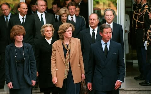 Prince Charles leaves the Salpetriere Hospital with Princess Diana's sisters Lady Jane Fellowes, centre, and Lady Sarah McCorquodale, far left after they came to collect Diana's body in Paris  - Credit: AP PHOTO/Laurent Rebours