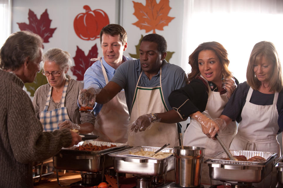 People serving food at a homeless shelter