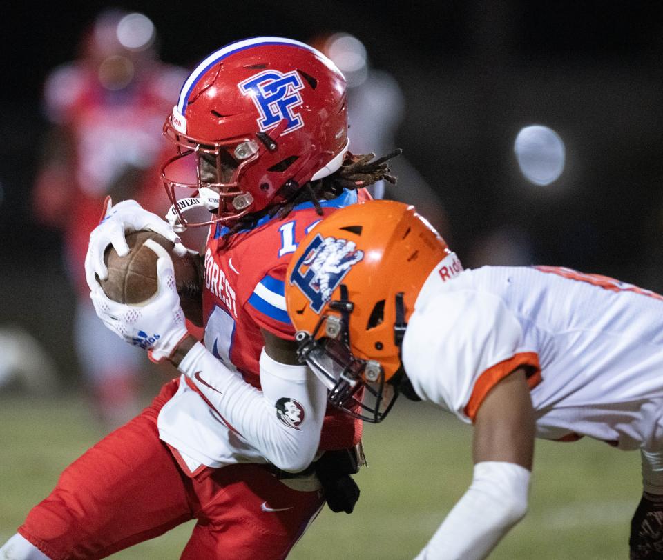 (14) carries the ball during the Escambia vs Pine Forest football game at Pine Forest High School in Pensacola on Friday, Oct. 20, 2023.