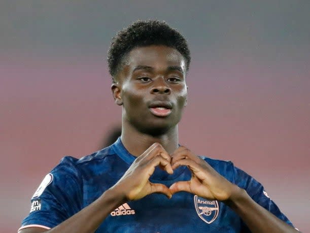 Bukayo Saka of Arsenal celebrates after scoring (Getty)