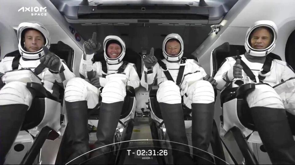 This photo provided by SpaceX shows the SpaceX crew seated in the Dragon spacecraft on Friday, April 8, 2022 in Cape Canaveral, Fla.  SpaceX is scheduled to launch  three rich businessmen and their astronaut escort to the International Space Station for more than a week’s stay.  (SpaceX via AP)