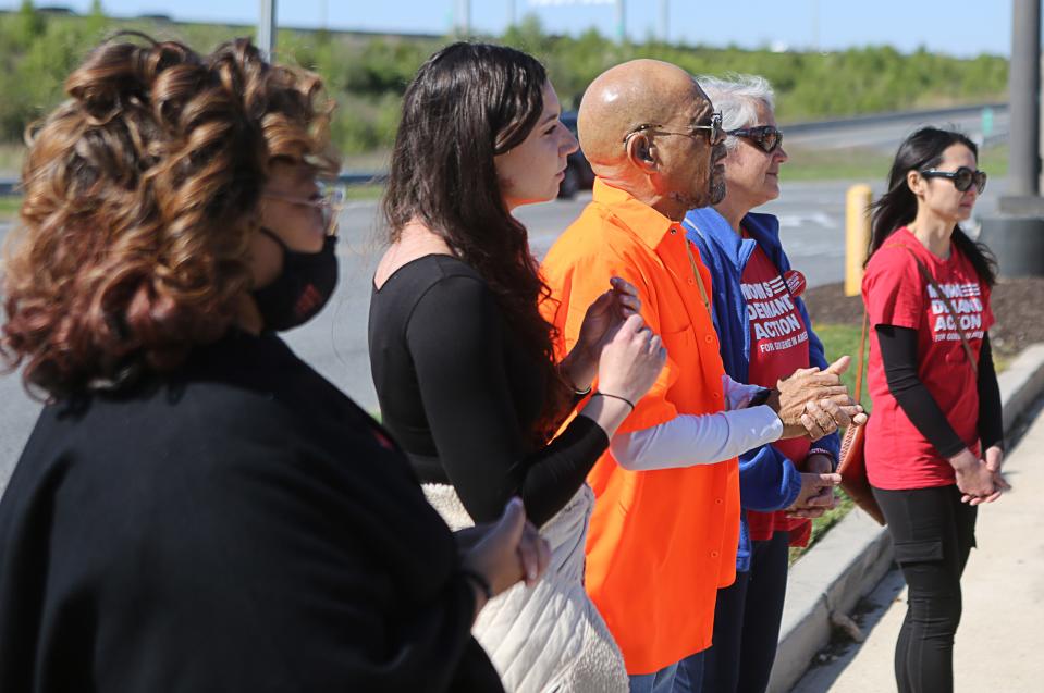 Various organizations held a prayer circle in the parking lot of the Christiana Mall on Monday April 10, 2023 two days after a shooting in the food court injured three people.