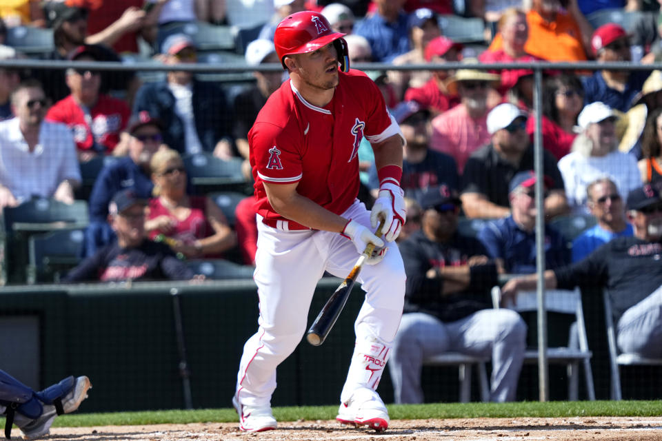 Los Angeles Angels' Mike Trout runs out a fly-out against the Cleveland Guardians during the fourth inning of a spring training baseball game, Monday, March 6, 2023, in Tempe, Ariz. (AP Photo/Matt York)