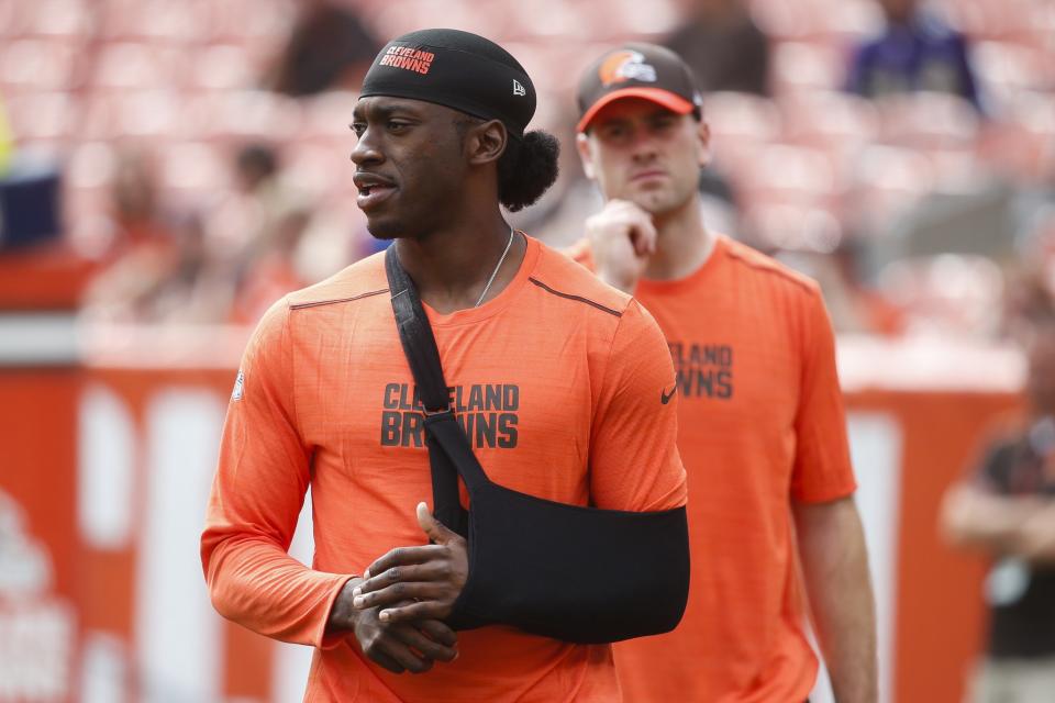 <p>Cleveland Browns quarterback Robert Griffin III stands on the field with his arm in a sling during practice before an NFL football game against the Baltimore Ravens, Sunday, Sept. 18, 2016, in Cleveland. (AP Photo/David Richard) </p>