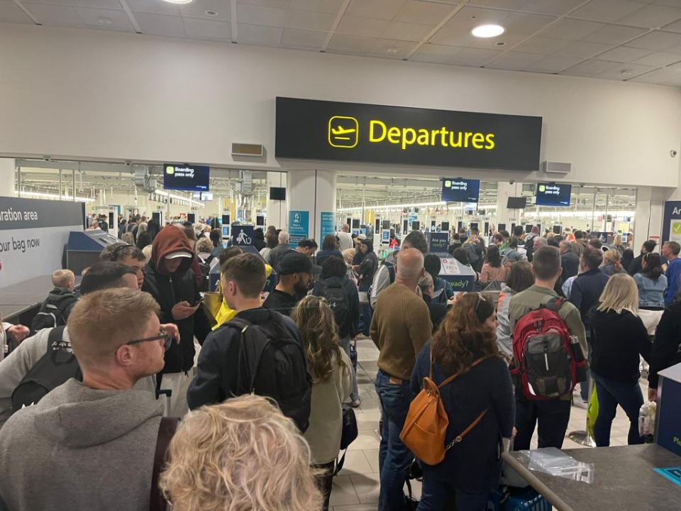 Passengers queue at Gatwick airport (Elliot Wagland)