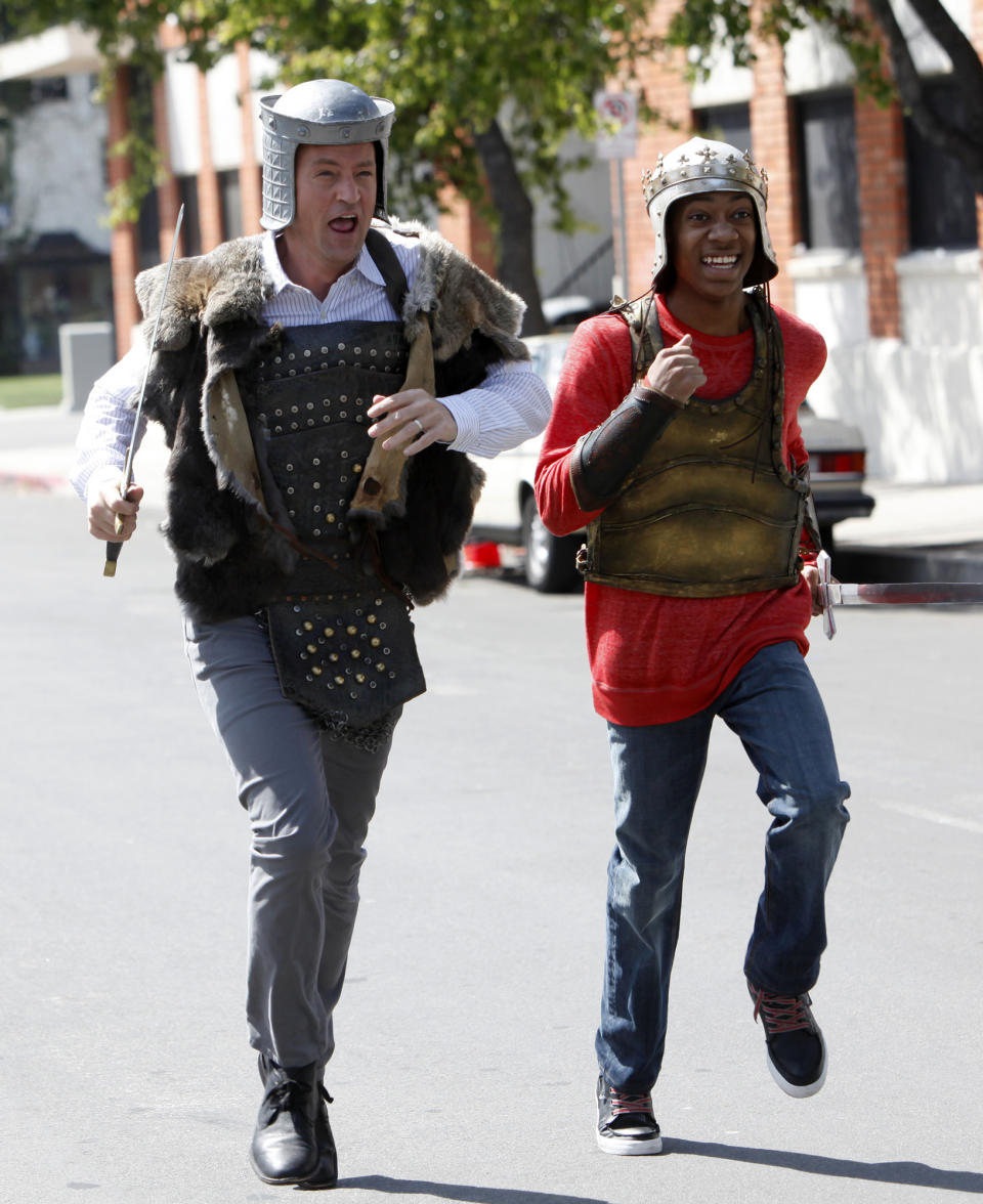 This undated image released by NBC shows Matthew Perry portraying Ryan King, left, and Tyler James Williams as Owen in the pilot episode of "Go On." Sneak peeks of NBC's new prime-time schedule will piggyback on network coverage of the 2012 Summer Olympic Games. The unveiling will begin with commercial-free sneak previews of NBC's new comedies "Go On" on Aug. 8, after the evening's Olympics coverage, and of "Animal Practice" on Aug. 12, following the Olympics' Closing Ceremonies. (AP Photo/NBC, Jordin Althaus)