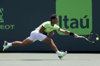 Mar 31, 2017; Miami, FL, USA; Rafael Nadal of Spain reaches for a forehand against Fabio Fognini of Italy (not pictured) during a men's singles semi-final in the 2017 Miami Open at Brandon Park Tennis Center. Nadal won 6-1, 7-5. Geoff Burke-USA TODAY Sports