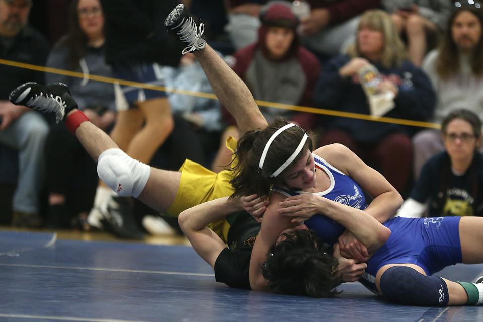 Scituate’s Sara McLaughlin (113 lbs) has a hold of Bristol Aggie’s Griffin Machie in the semifinal round of the Cohasset Wrestling Tournament at Cohasset High on Saturday, Jan. 21,  2023. 