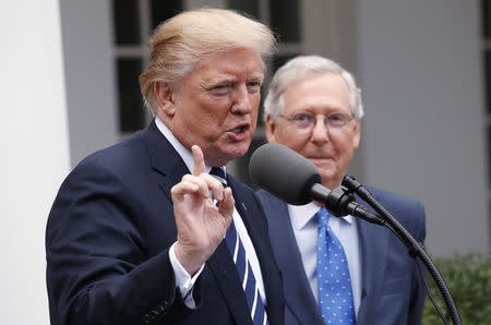 FILE PHOTO: U.S. President Donald Trump speaks to the media with U.S. Senate Majority Leader Mitch McConnell at his side in the Rose Garden of the White House in Washington, U.S., October 16, 2017. REUTERS/Kevin Lamarque