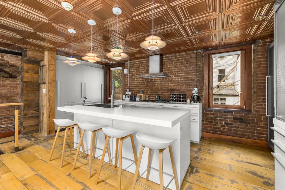 A copper-ceilinged kitchen. Real Estate Production Network