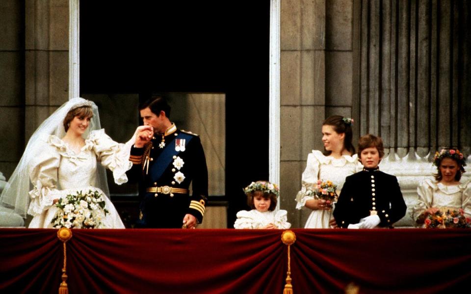 The Prince and Princess of Wales on the Palace balcony on their wedding day (PA) (PA Archive)